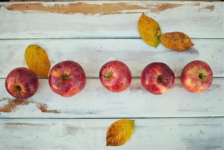 five red apple fruits on white wood pallet thumbnail