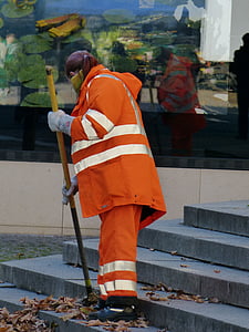 man sweeping on ladder thumbnail