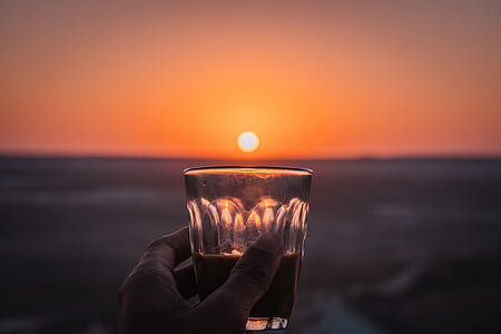 person holding drinking glass thumbnail