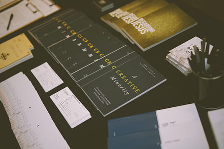 assorted books on table thumbnail