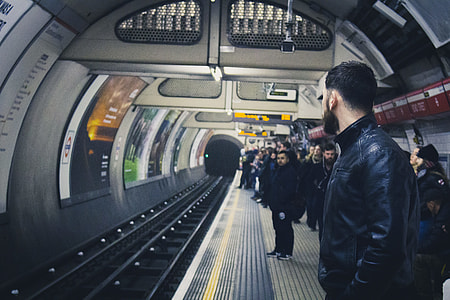 man standing in front of railway thumbnail