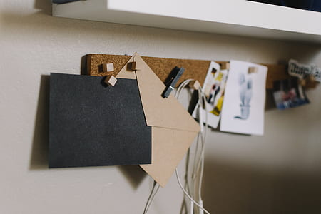 two black and beige paper envelopes in pin organizer thumbnail