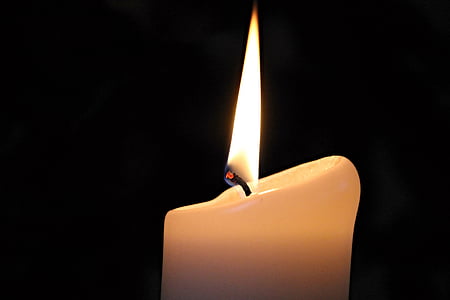 lighted white candle thumbnail