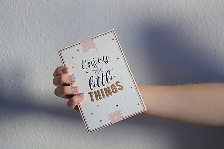 person holding white box thumbnail