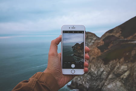 person holding iPhone 7 taking photo during daytime thumbnail
