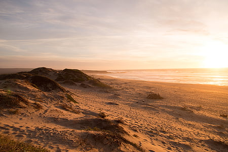 hills near shore during golden hour thumbnail