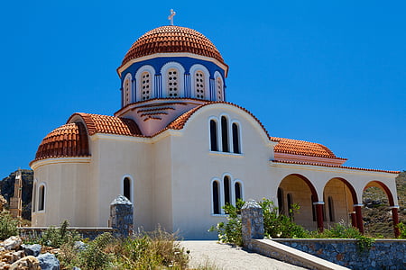 white and brown building at daytime thumbnail