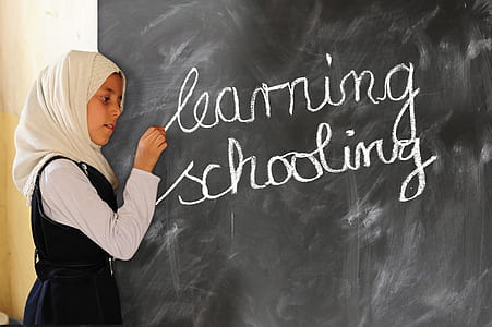 girl writing learning schooling at chalkboard thumbnail