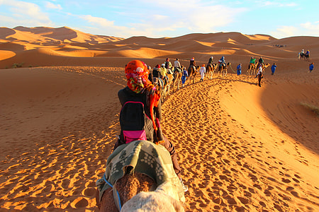 men walking in desert during daytime thumbnail