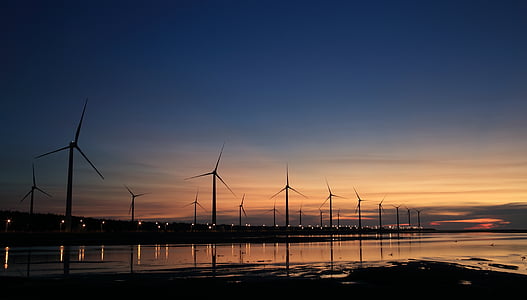 wind mills during golden hour panoramic photography thumbnail