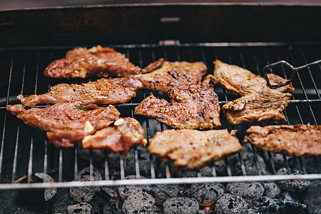 Pork and sausage on the grill thumbnail