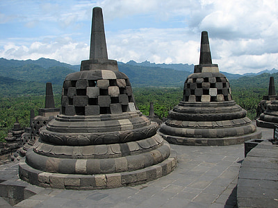 concrete structures near green forest thumbnail