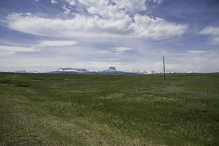 Distant Mountains under cloudy skies in Alberta thumbnail