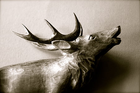 closeup photo of buck figurine thumbnail
