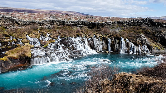 waterfalls near green grass field thumbnail