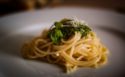 pasta with herb toppings on white ceramic plate thumbnail