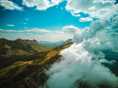 mountain under white and blue sky thumbnail