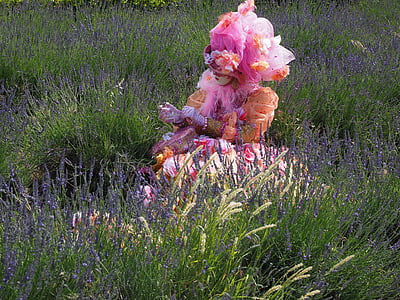 woman sitting on green grass field during daytime thumbnail