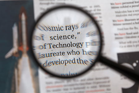Technology word in magnifying glass thumbnail