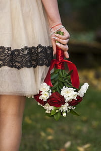 woman holding bouquet of white flowers thumbnail