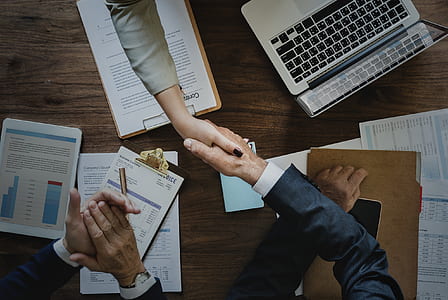 flat lay photography of persons shaking hands thumbnail