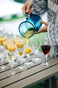 Glasses of orange juice, wine and water thumbnail