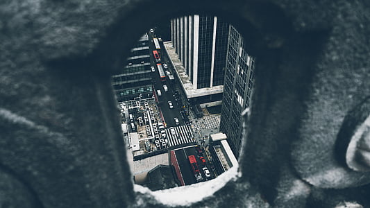 aerial view of vehicles on road near city buildings thumbnail