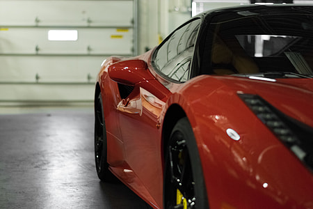 red Ferrari 488 GTB on garage thumbnail