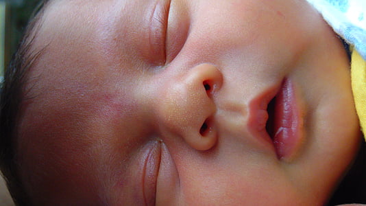 closeup photo of baby's face thumbnail