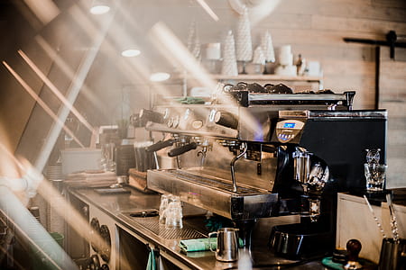 black metal espresso maker on gray metal stand thumbnail