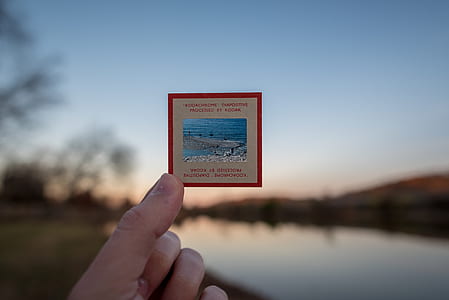 person holding mail stamp thumbnail