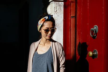 woman standing in front of a closed door thumbnail