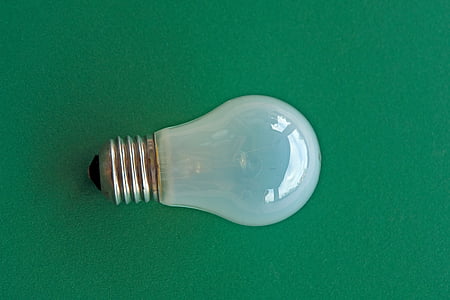 clear halogen bulb light on green surface thumbnail