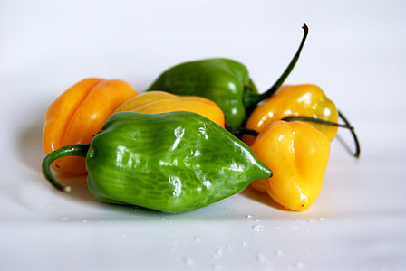 yellow and green chilis on white surface thumbnail