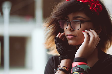 woman holding her cheek while looking sideward thumbnail