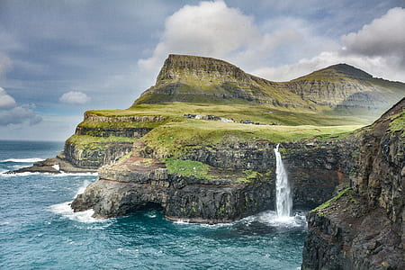 landscape photography of waterfalls and mountain thumbnail
