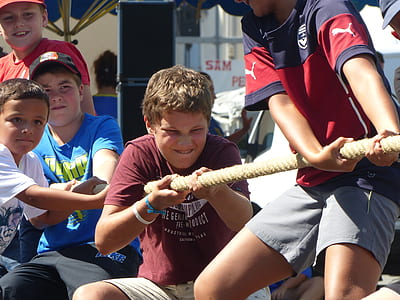 boy pulling brown rope thumbnail