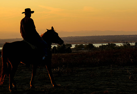 silhouette of man riding horse thumbnail