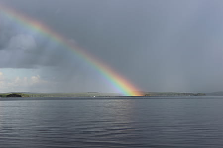 body of water near rainbow thumbnail