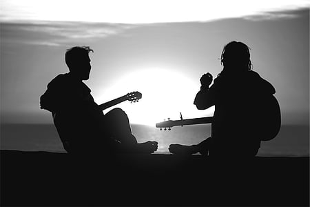 silhouette photo of 2 persons during golden hour thumbnail