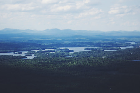 photo of mountains and body of water thumbnail
