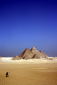 Grey Concrete Pyramids on the Middle of the Dessert during Daytime thumbnail