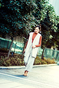 Photography of A Woman Walking thumbnail