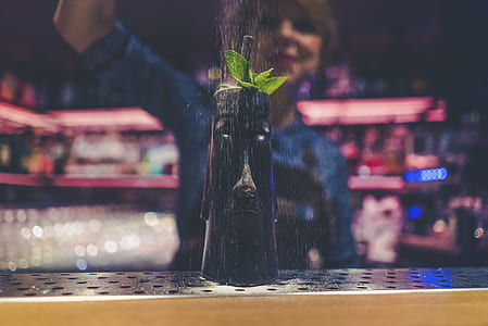 shallow focus photography of black bottle thumbnail
