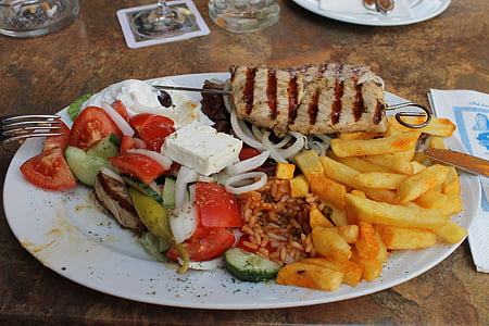 cooked meat and potato fries on ceramic plate thumbnail