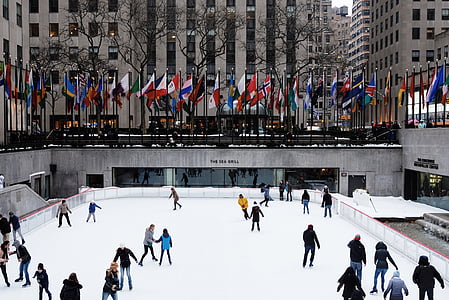 group of people ride ice skates thumbnail