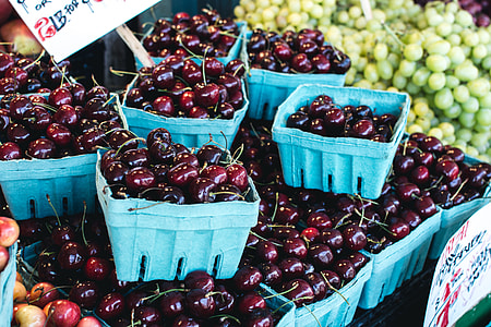 Dark red cherries on a market thumbnail