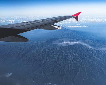 flying grey and red plane thumbnail