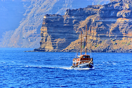sail ship beside mountain thumbnail