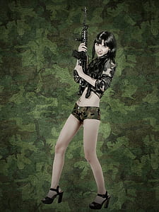 woman carrying rifle thumbnail